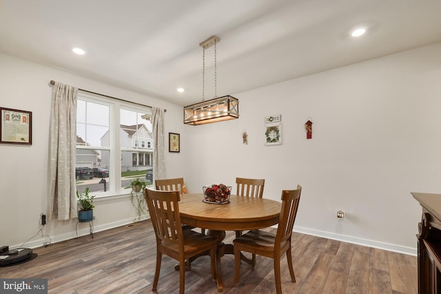 dining room featuring recessed lighting, dark wood finished floors, and baseboards