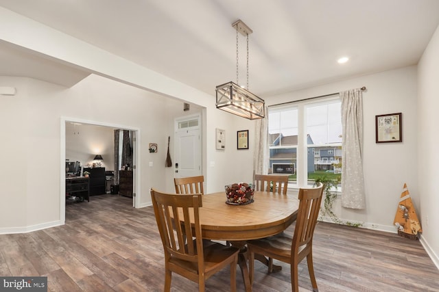 dining space featuring recessed lighting, wood finished floors, and baseboards