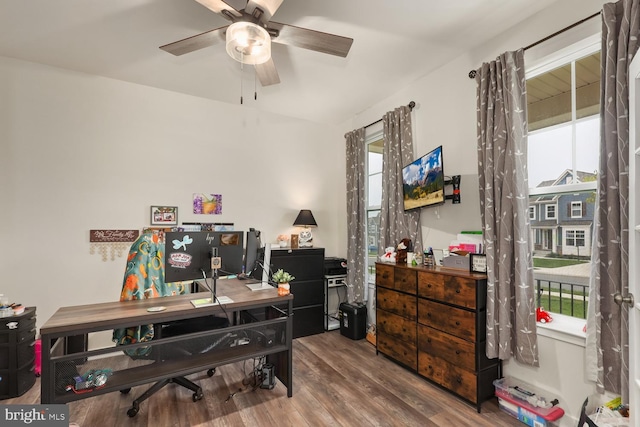 home office featuring ceiling fan, wood finished floors, and a healthy amount of sunlight