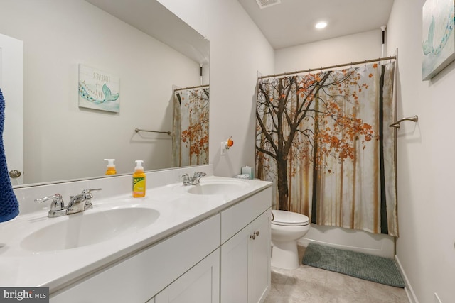 full bath featuring visible vents, double vanity, a sink, and toilet