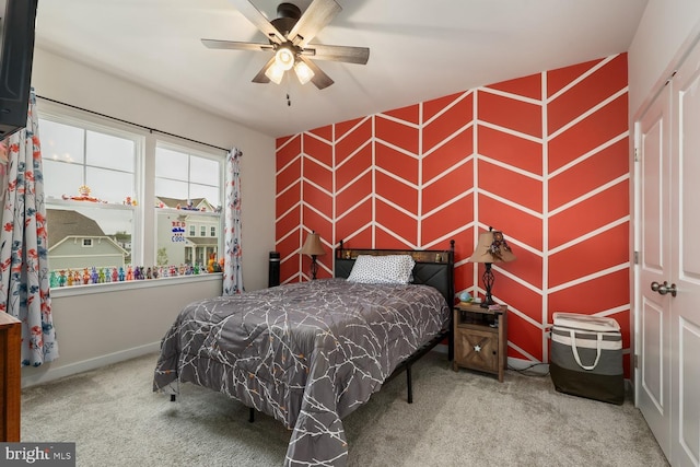 carpeted bedroom featuring baseboards