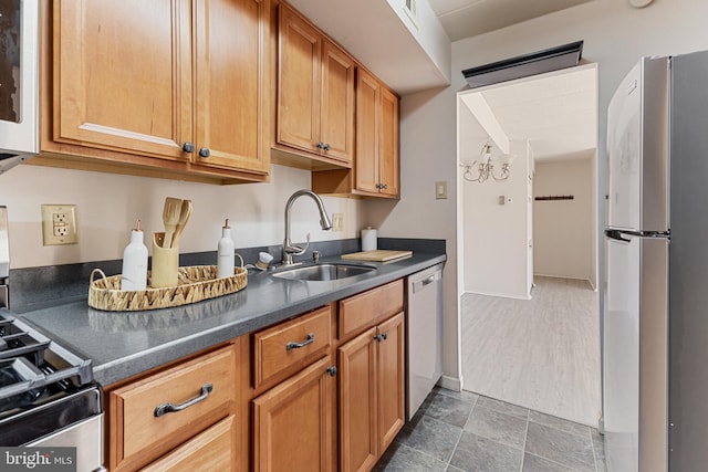 2630 Fort Farnsworth Rd Unit 149, Alexandria, VA 22303 - kitchen with stainless steel appliances, dark countertops, and brown cabinets