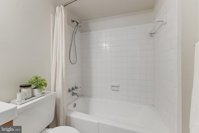 full bathroom featuring toilet, vanity, and shower / tub combo with curtain