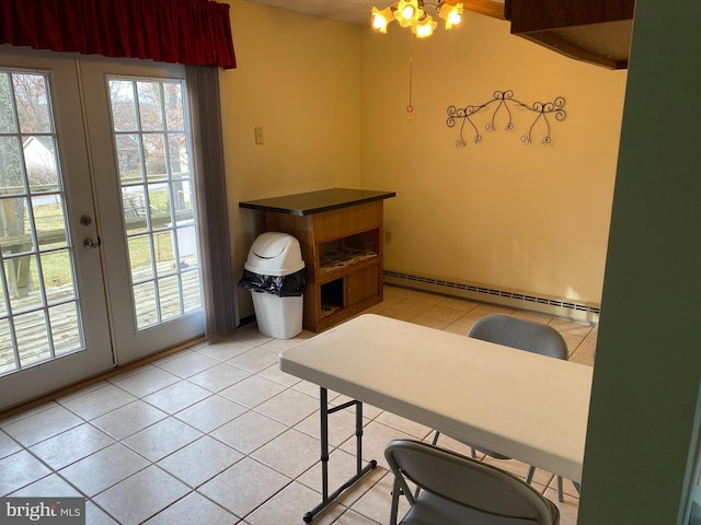 tiled home office with french doors and a baseboard heating unit