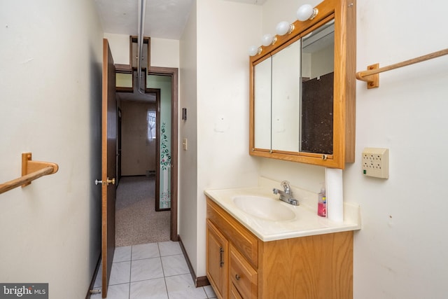 bathroom featuring tile patterned flooring and vanity