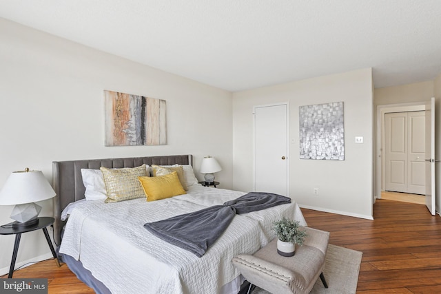 bedroom featuring dark wood-type flooring