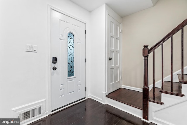 foyer entrance with dark hardwood / wood-style floors