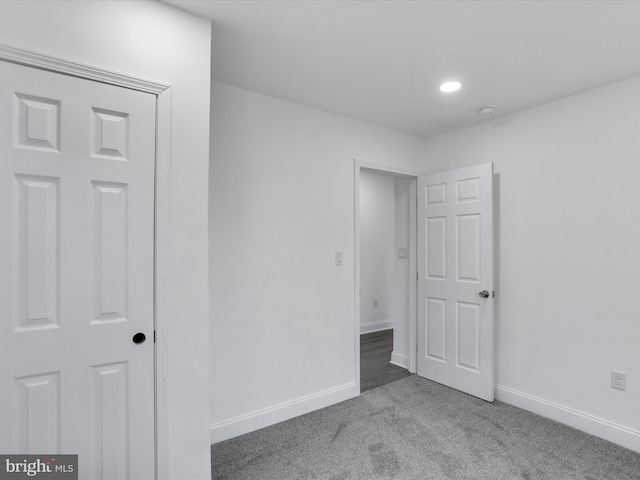 empty room featuring carpet flooring