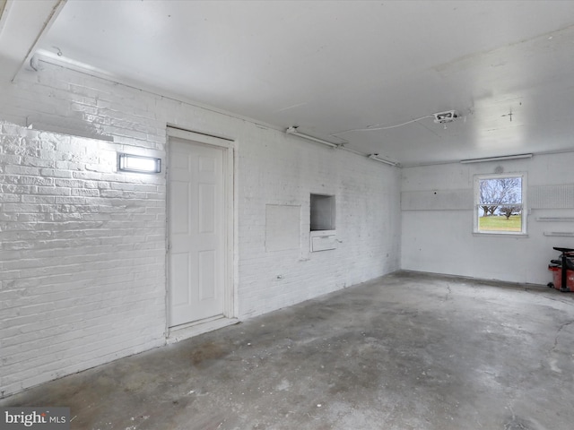 basement with brick wall