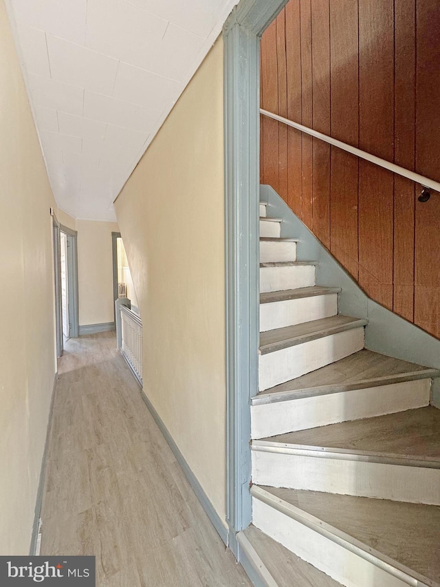 stairway with wood-type flooring