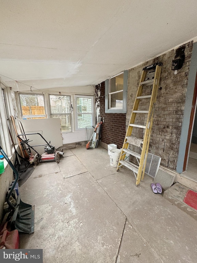 unfurnished sunroom featuring a wealth of natural light