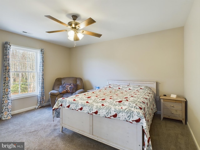 bedroom featuring dark colored carpet and ceiling fan