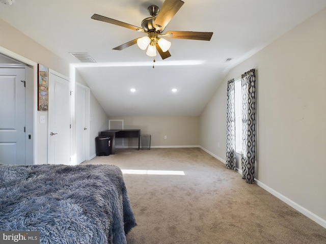 bedroom featuring ceiling fan, light colored carpet, and lofted ceiling