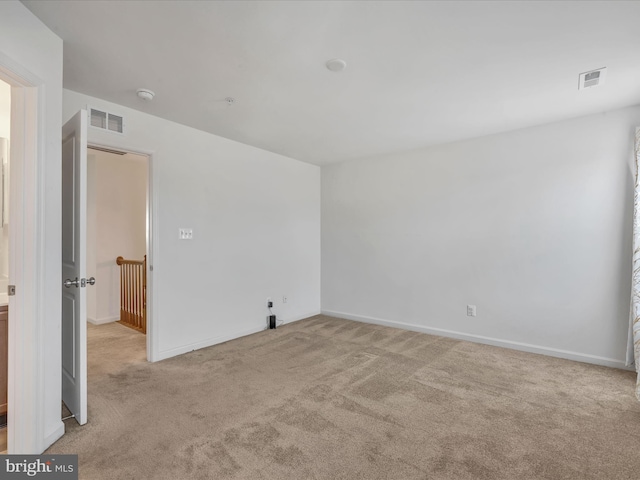 spare room with light carpet