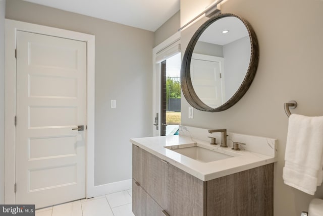 bathroom featuring tile patterned floors and vanity