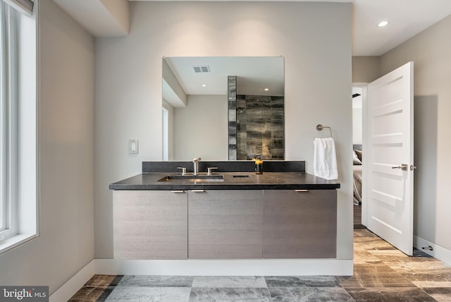 bathroom featuring wood-type flooring and vanity