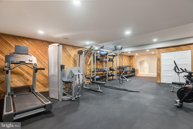 workout area with wooden walls