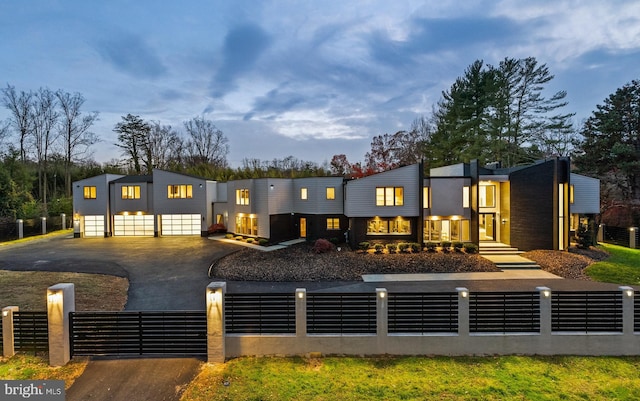 view of back house at dusk