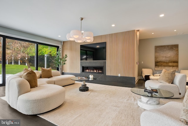 living room featuring a chandelier and hardwood / wood-style flooring