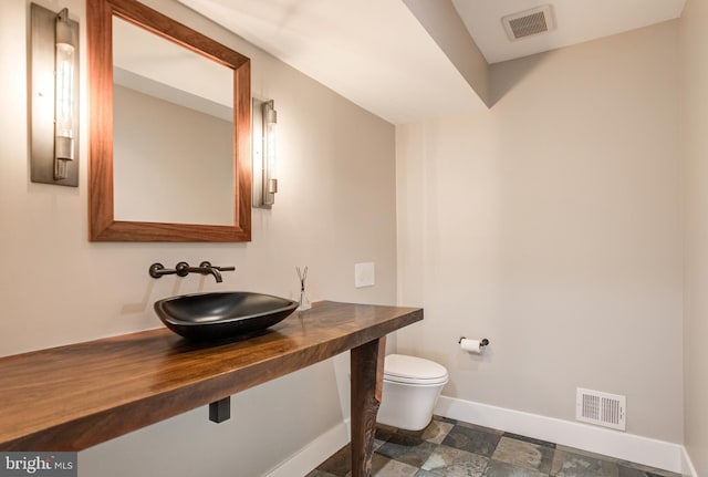 bathroom with toilet and sink