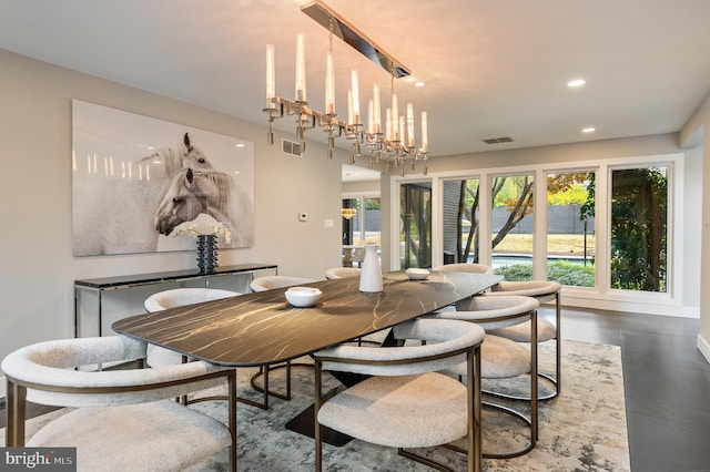 dining space with a chandelier