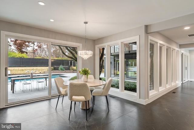 dining space with a notable chandelier