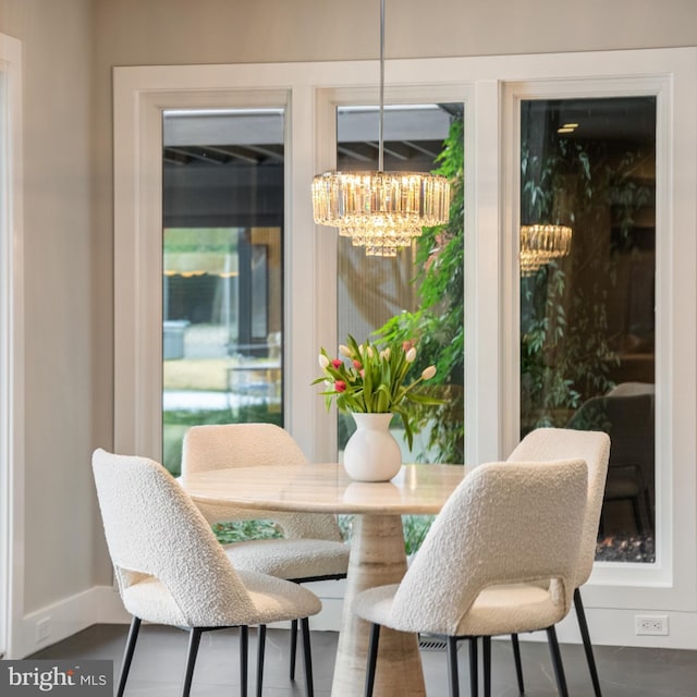 dining space featuring a notable chandelier