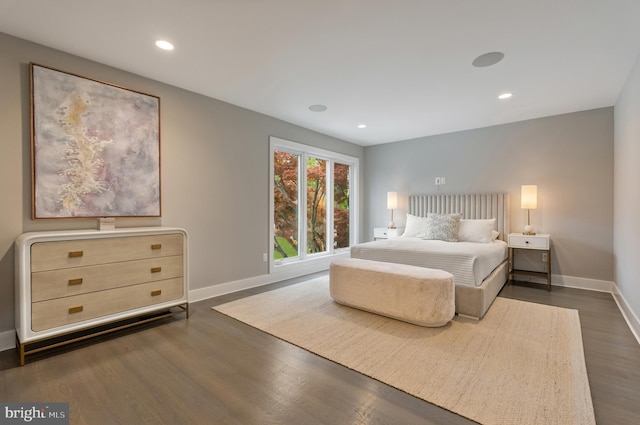 bedroom with dark wood-type flooring