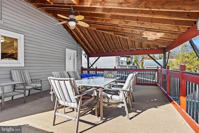 view of patio with ceiling fan and a deck