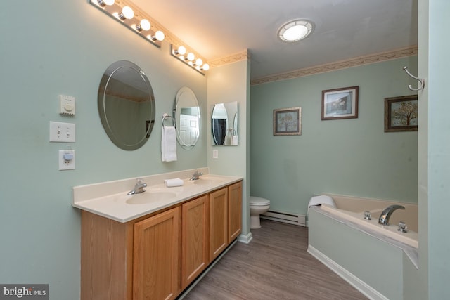 bathroom with a baseboard radiator, a tub to relax in, toilet, vanity, and hardwood / wood-style flooring