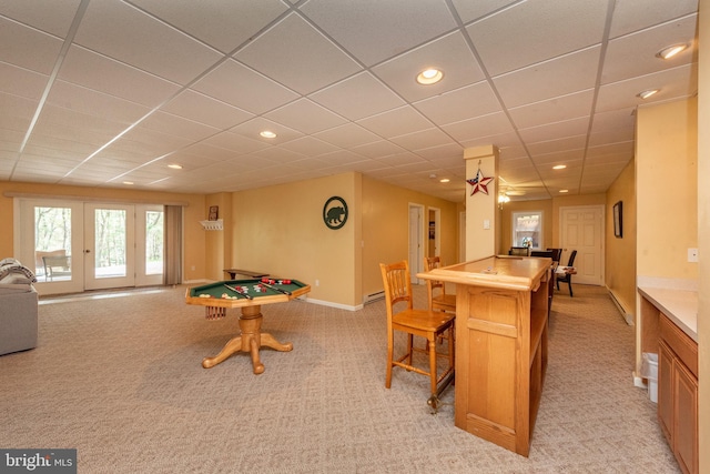 game room featuring french doors, a paneled ceiling, light colored carpet, and ceiling fan