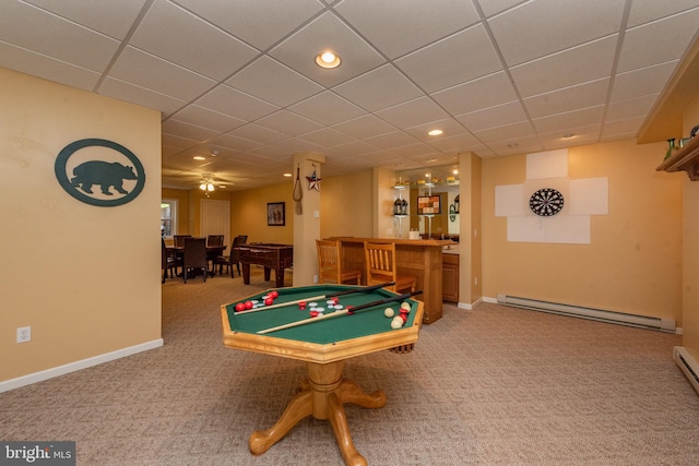 playroom with carpet flooring, a drop ceiling, baseboard heating, ceiling fan, and bar area