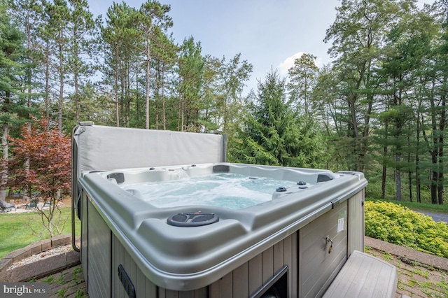 exterior space with a hot tub