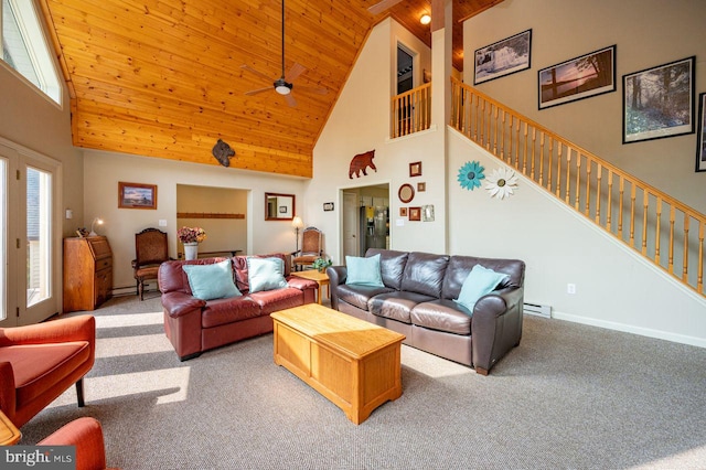 living room with a wealth of natural light, high vaulted ceiling, light carpet, and ceiling fan