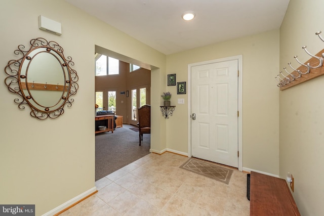 carpeted foyer with french doors