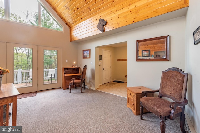 living area with light colored carpet, high vaulted ceiling, and wood ceiling