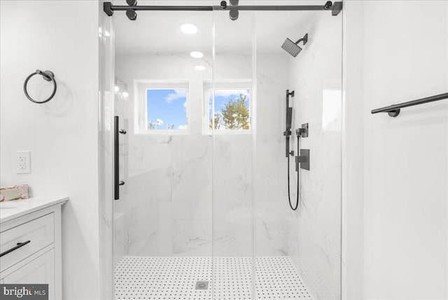 bathroom with vanity and walk in shower