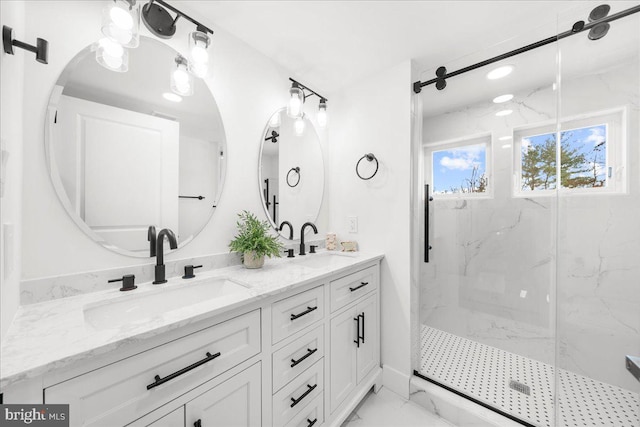 bathroom with vanity and an enclosed shower