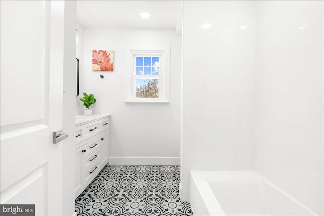 bathroom with tile patterned flooring and vanity