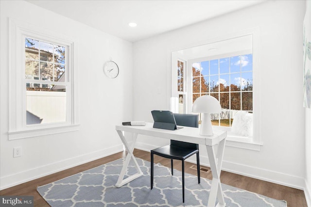 office with dark wood-type flooring