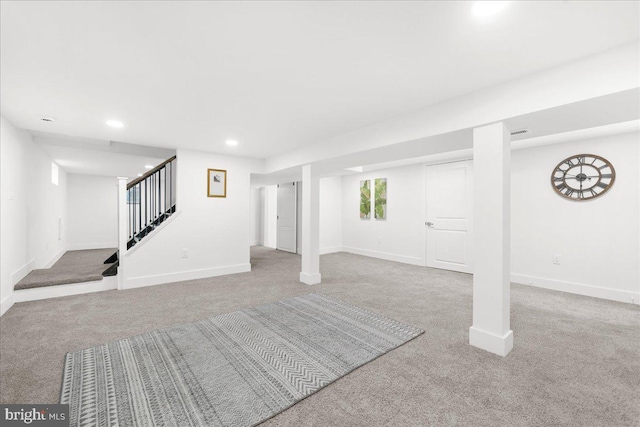 basement with light colored carpet