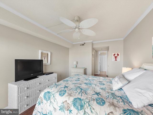 bedroom featuring ceiling fan, crown molding, and wood-type flooring