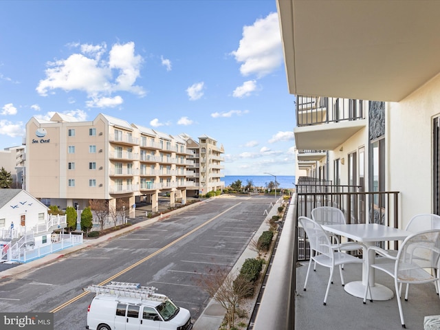 balcony featuring a water view