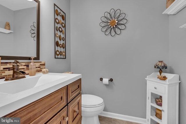 bathroom with decorative backsplash, tile patterned floors, vanity, and toilet