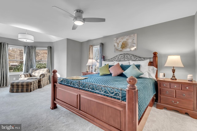 bedroom with ceiling fan and light carpet