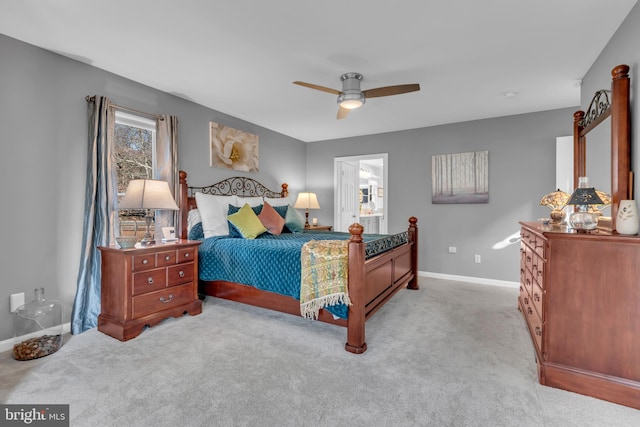 bedroom featuring light carpet and ceiling fan