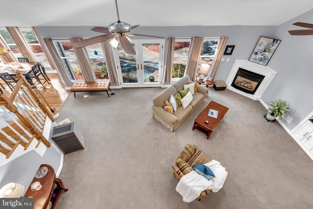 living room with french doors, carpet floors, and a wealth of natural light