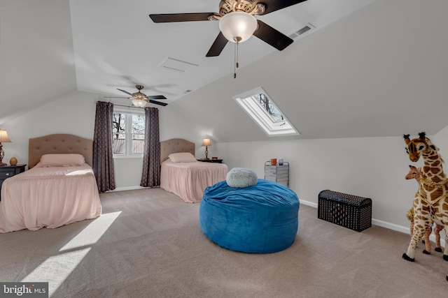 carpeted bedroom featuring ceiling fan and lofted ceiling with skylight