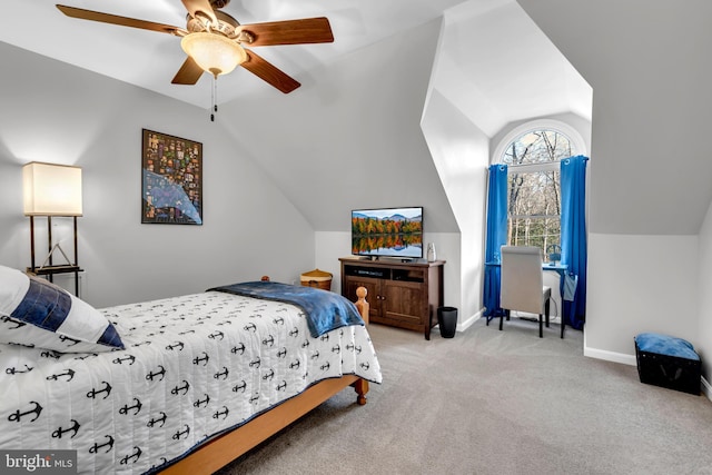 bedroom with ceiling fan, light colored carpet, and vaulted ceiling