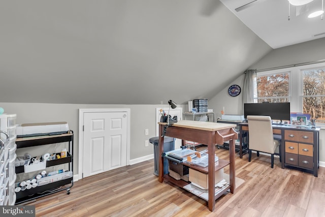 office space featuring ceiling fan, light hardwood / wood-style flooring, and lofted ceiling